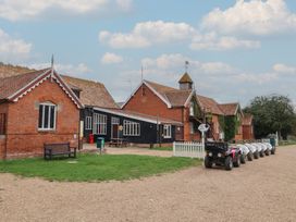 An outdoor area with buildings and quad bikes at Molly (Cow Shed 6) Woodbridge