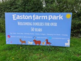 A promotional sign for Easton Farm Park welcoming families for over 50 years