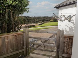 An outdoor area with a gate and clothesline at The Lodge in Bridgend
