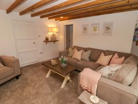 A living room with a sofa and coffee table at Penwyn in Solva