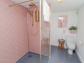 A bathroom with a shower and toilet at Penwyn in Solva