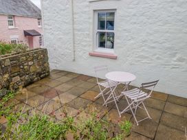 A table and chairs in an outdoor area at Penwyn in Solva
