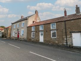 A row of houses along a road at 32 Castlegate in Scarborough