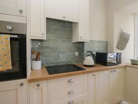 A kitchen with an oven, kettle, and toaster at The Barn at Grasmere
