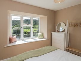 A bedroom with a window and a bed at The Barn at Grasmere in Grasmere
