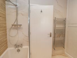 A bathroom with a shower and bathtub at The Barn at Grasmere