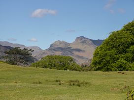 A landscape featuring mountains and trees at The Barn at Grasmere in Grasmere