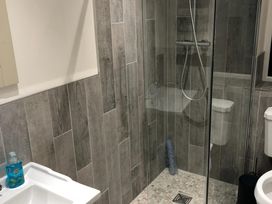 A bathroom with a shower and toilet at Pen Y Ffrith Lodge in Prestatyn