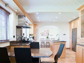 A kitchen with countertops and appliances at Cae Coch Brynteg near Benllech