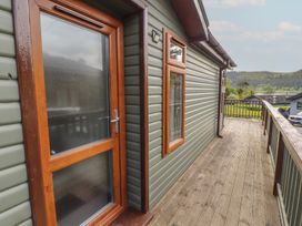 A door and windows on a wooden deck at 28 Troutbeck in Bassenthwaite
