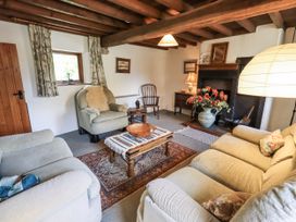 A living room with sofa and table at Chapel Cottage Ennerdale near Cleator Moor