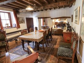 A dining room with a table and chairs at Chapel Cottage in Ennerdale near Cleator Moor