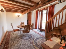 A dining room with a table and chairs at Chapel Cottage in Ennerdale near Cleator Moor