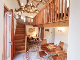 A dining area with a table and chairs at Chapel Cottage Ennerdale near Cleator Moor