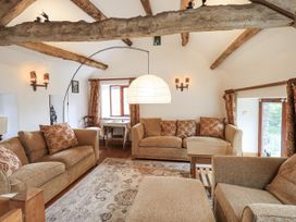 A living room with a sofa and table at Chapel Cottage in Ennerdale near Cleator Moor