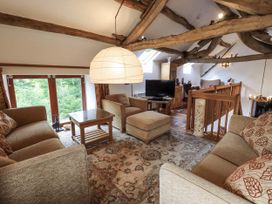 A living room with sofas and a television at Chapel Cottage Ennerdale near Cleator Moor