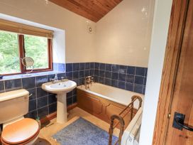 A bathroom with a sink, toilet, and bathtub at Chapel Cottage Ennerdale near Cleator Moor