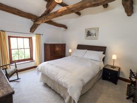 A bedroom with a bed and a chest of drawers at Chapel Cottage Ennerdale near Cleator Moor