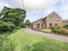 A house with a garden and pathway at Chapel Cottage in Ennerdale near Cleator Moor