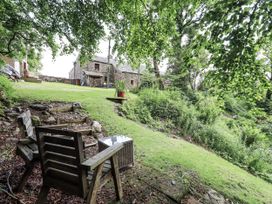 A garden with chairs and a table at Chapel Cottage in Ennerdale near Cleator Moor