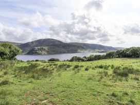 A view of a lake surrounded by mountains at Chapel Cottage in Ennerdale near Cleator Moor