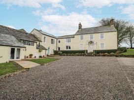 A house with a driveway and garden at Swift Barn in Wigton