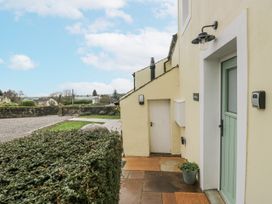 An exterior view with a door and pathway at Swift Barn in Wigton