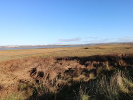 A landscape with water and grass at Kites - 52 Gower Holiday Village Scurlage near Port Eynon and Rhossili