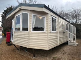 A caravan with windows and a door at Caravan 941 in Clacton-On-Sea