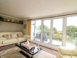 A living room with a sofa and coffee table at 3 Chantry Hill in Kingsbridge