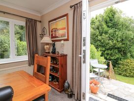 A dining room with a table and chairs visible at 3 Chantry Hill in Kingsbridge