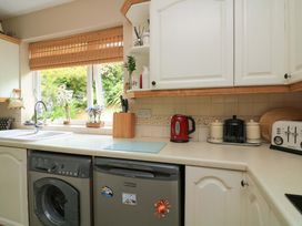 A kitchen with a sink and appliances at 3 Chantry Hill in Kingsbridge