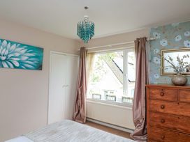 A bedroom with a chest of drawers and window at 3 Chantry Hill Kingsbridge