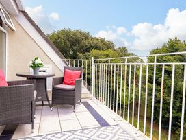 A balcony with outdoor furniture at 3 Chantry Hill in Kingsbridge