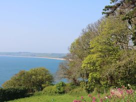 A view of the ocean and trees at 3 Chantry Hill in Kingsbridge