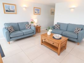 A living room with sofas and a coffee table at Tobys Quay in Falmouth