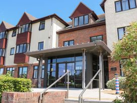 A building entrance with glass doors and windows at Bedroom 10 in Littlehampton
