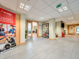 A lobby with a banner and display cabinet at Marine Court First Floor Double with Shower Room in Littlehampton