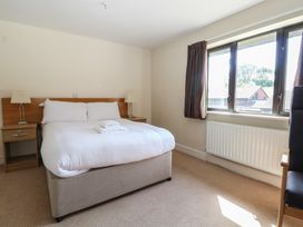 A bedroom with a bed and bedside tables at Sunset Quarters at Marine Court Littlehampton