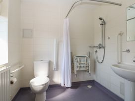A bathroom with a toilet and sink at Sunset Quarters at Marine Court Littlehampton