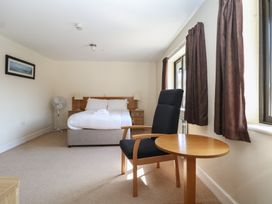 A bedroom with a bed and furniture at Sunset Quarters at Marine Court Littlehampton