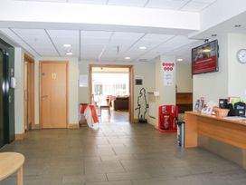 A lobby area with a reception desk at Sunset Quarters at Marine Court Littlehampton
