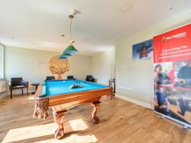 A recreation room with a pool table and seating at Marine Court First-floor Double Bedroom with Wet Room in Littlehampton