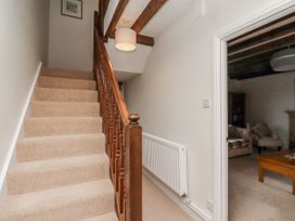 A staircase leading to an upper level at 3 Christon Bank Mews Alnwick