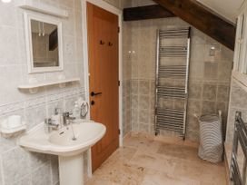 A bathroom with a sink and mirror at 3 Christon Bank Mews in Alnwick