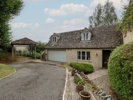 An outdoor area with a house and garage at St. Marys House Church Westcote near Bledington