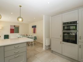 A kitchen with dining area and modern features at St. Marys House Church Westcote near Bledington