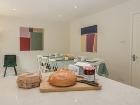 A dining room with a table set for breakfast at St. Marys House, Church Westcote near Bledington