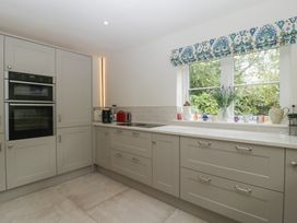 A kitchen featuring appliances and cabinets at St. Marys House Church Westcote near Bledington