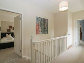 A hallway with a door leading to a bedroom at St. Marys House, Church Westcote near Bledington
